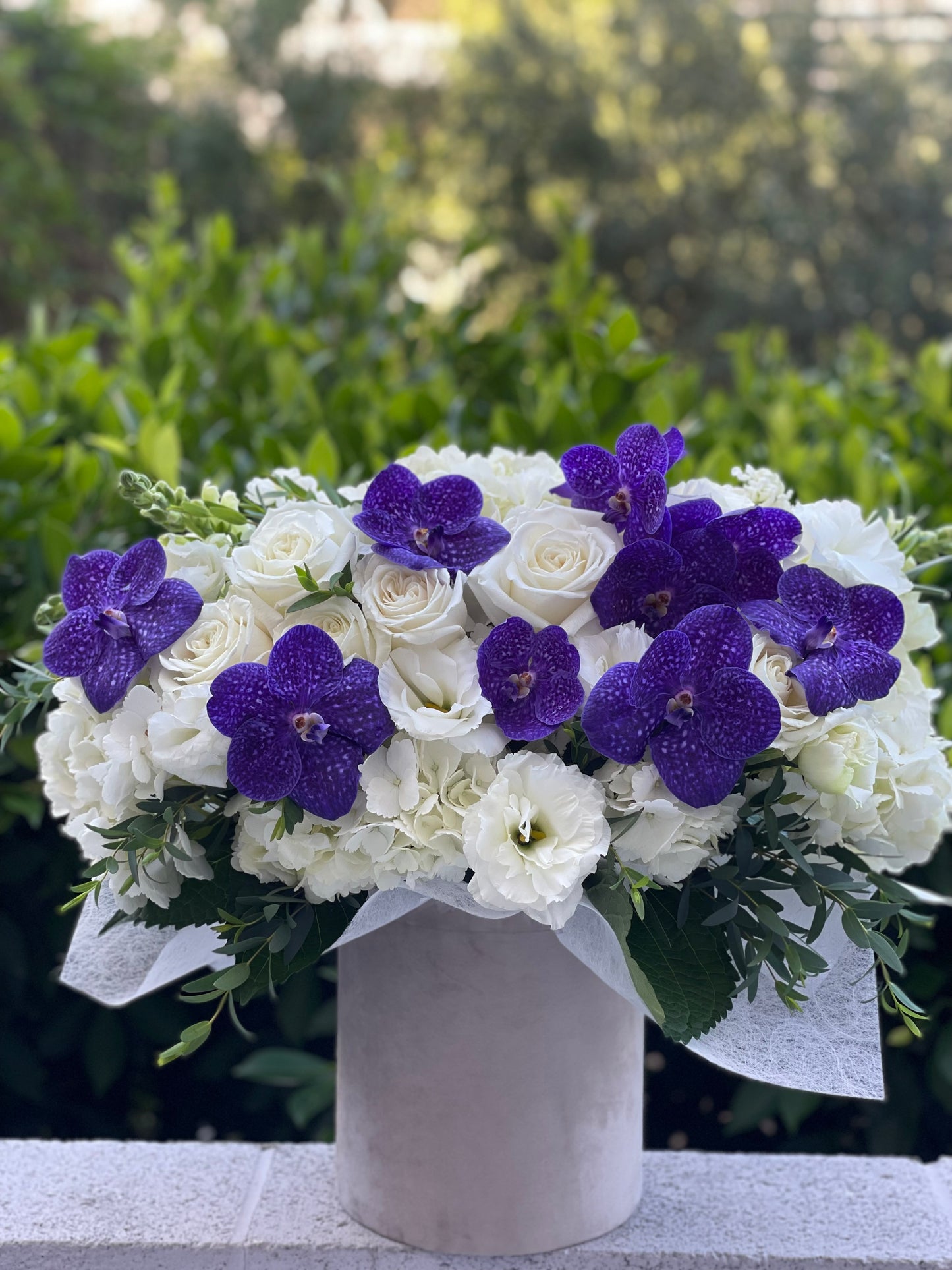 Box with purple orchids